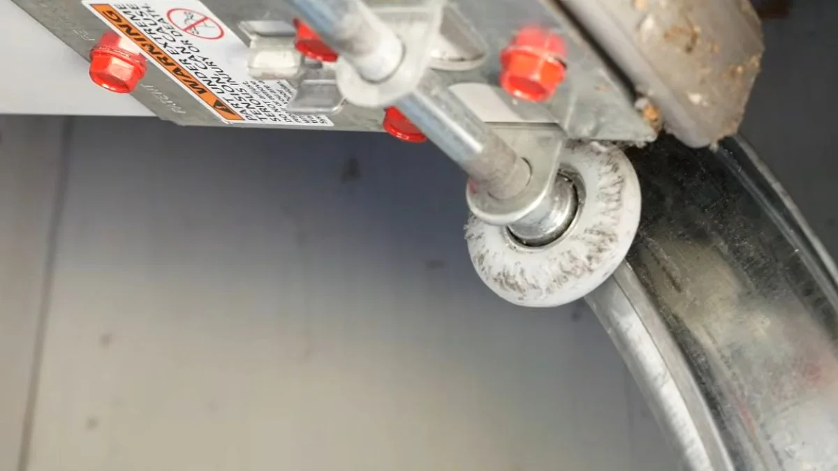 bottom garage door roller off track